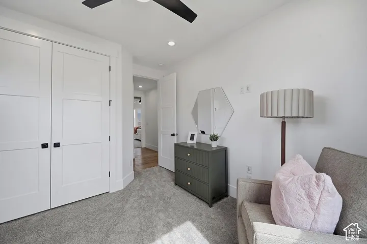 White walls and light gray carpeting create a bright interior