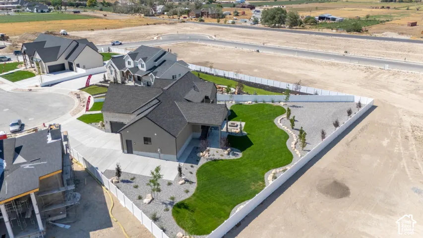 Expansive corner lot featuring a contemporary residence with a private driveway