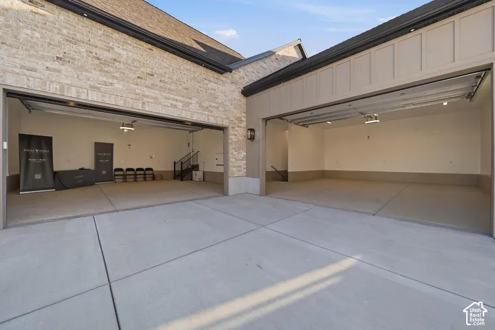 Concrete driveway with two attached garage bays