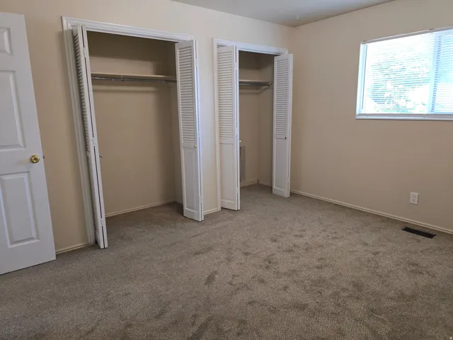 Neutral-toned carpeting throughout