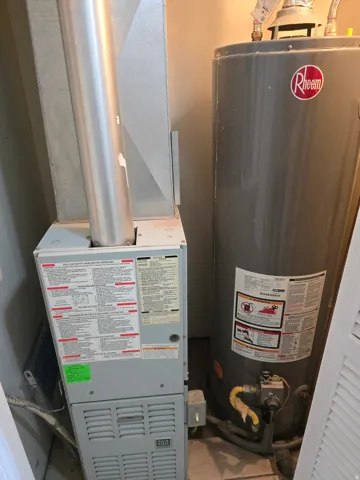 Water heater and furnace with exposed ductwork and utility connections
