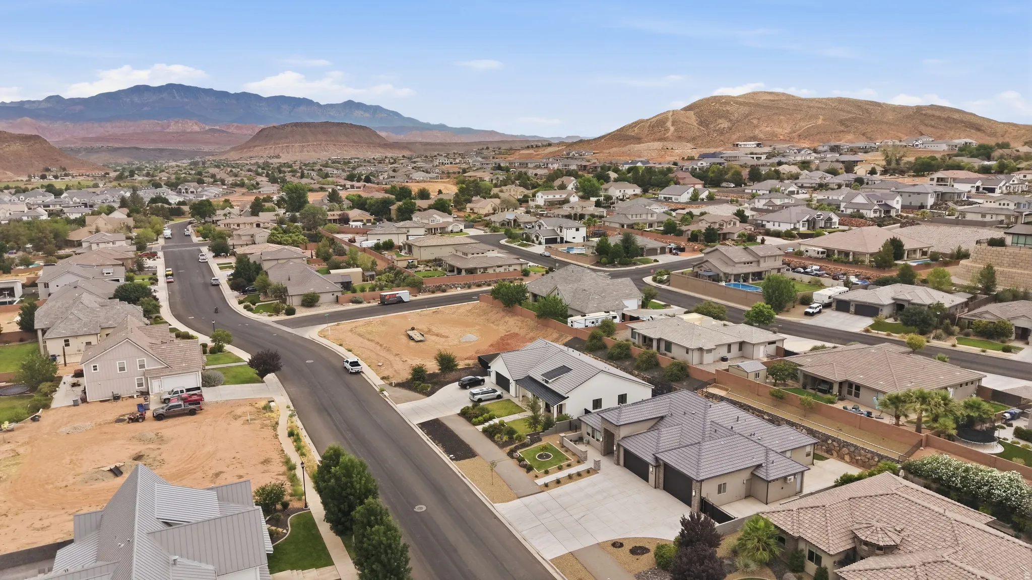 Residential neighborhood featuring paved streets, established homes, and arid landscaping