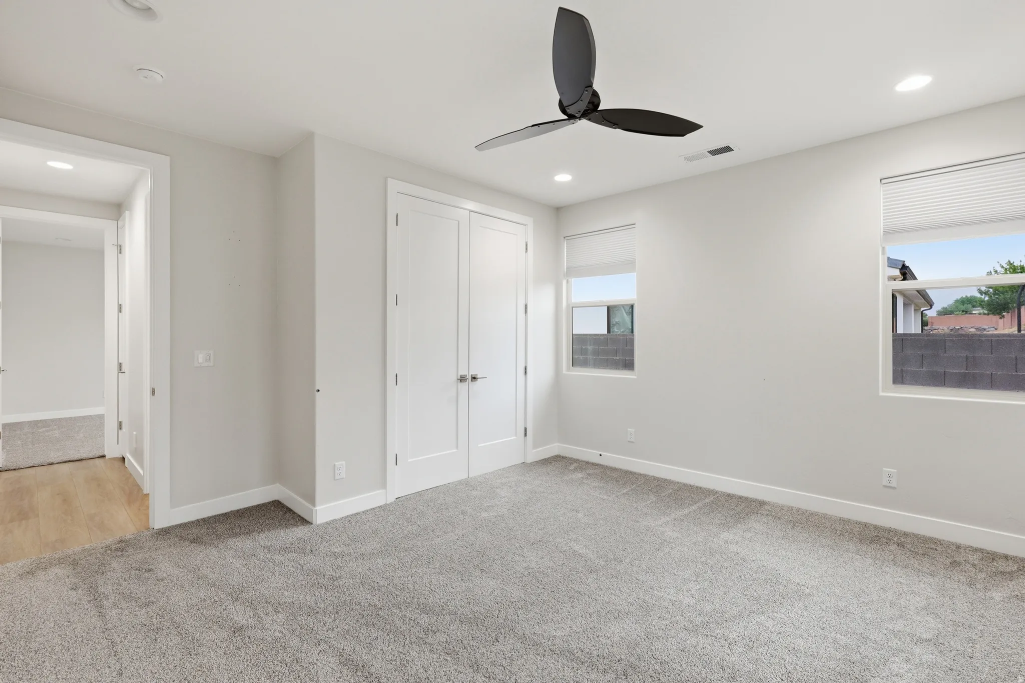 Room featuring neutral gray wall paint and matching gray carpeting