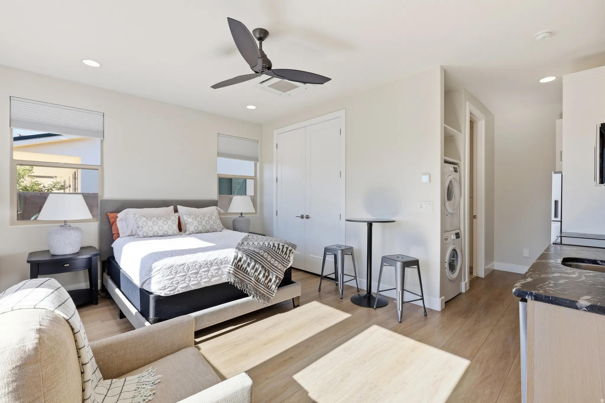 Bedroom featuring wood-finish flooring, recessed lighting, and a modern ceiling fan