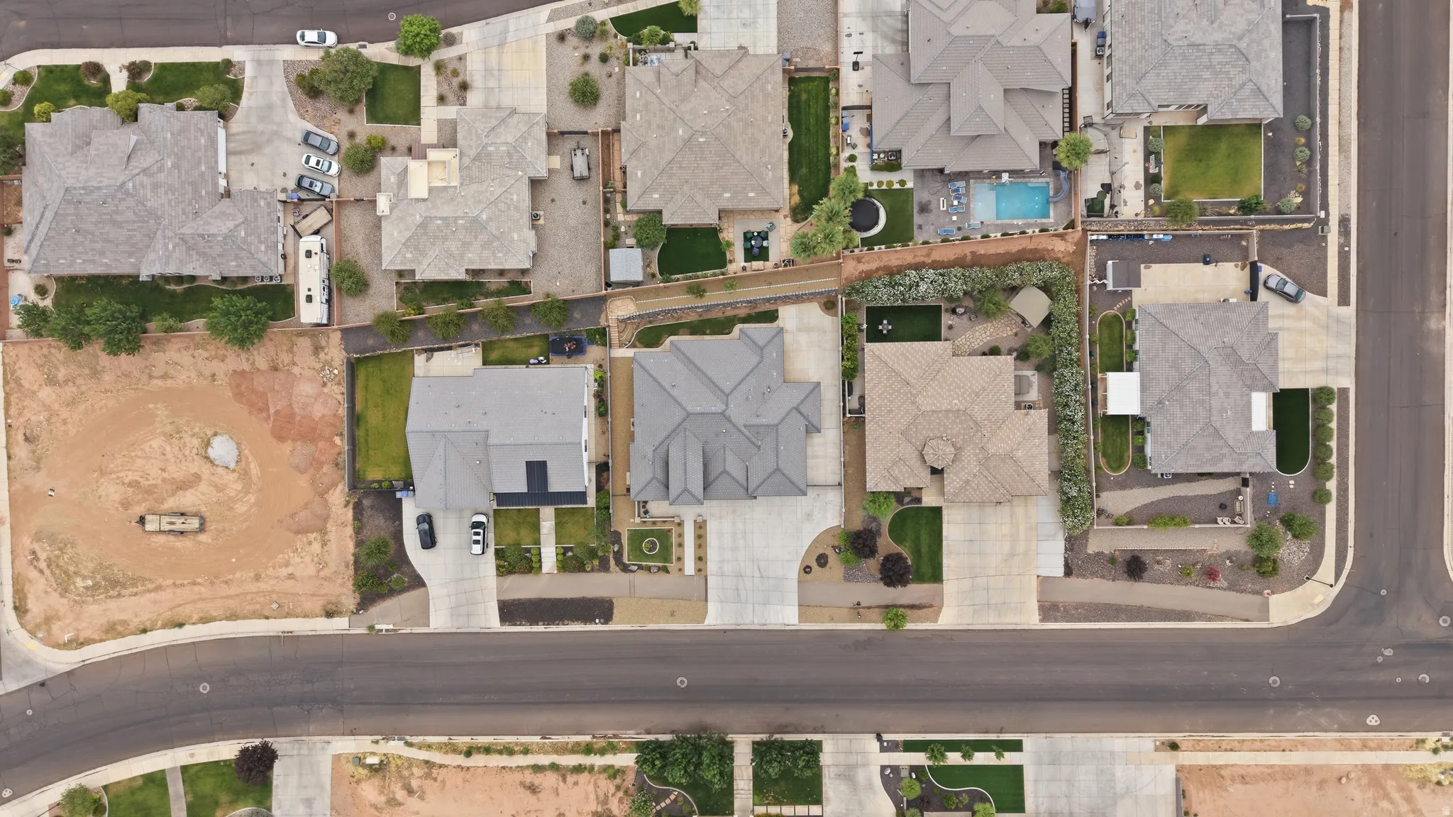 Residential neighborhood featuring multiple single-family homes, paved streets, and varied lot sizes