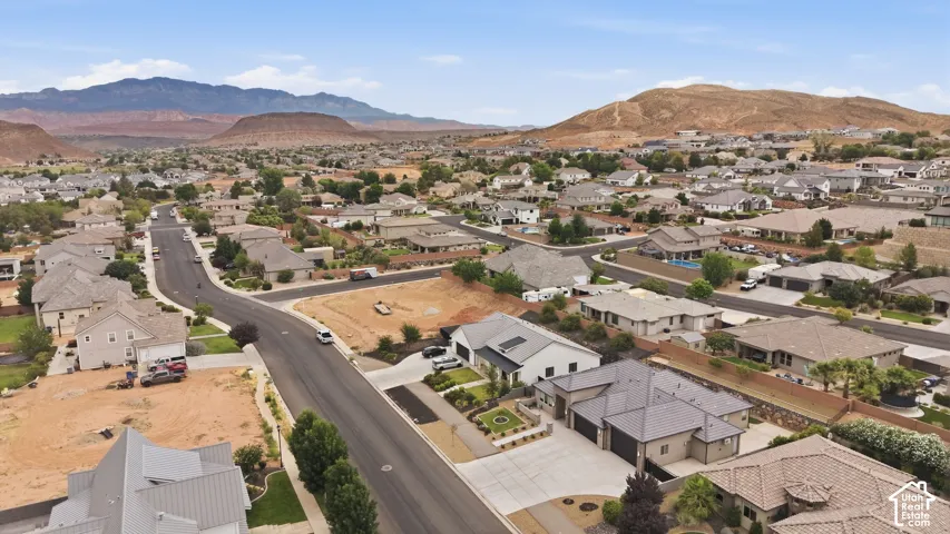 Residential neighborhood featuring paved streets, established homes, and arid landscaping