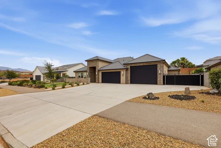Contemporary exterior with stone accents and a tile roof