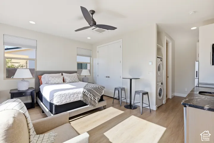 Bedroom featuring wood-finish flooring, recessed lighting, and a modern ceiling fan