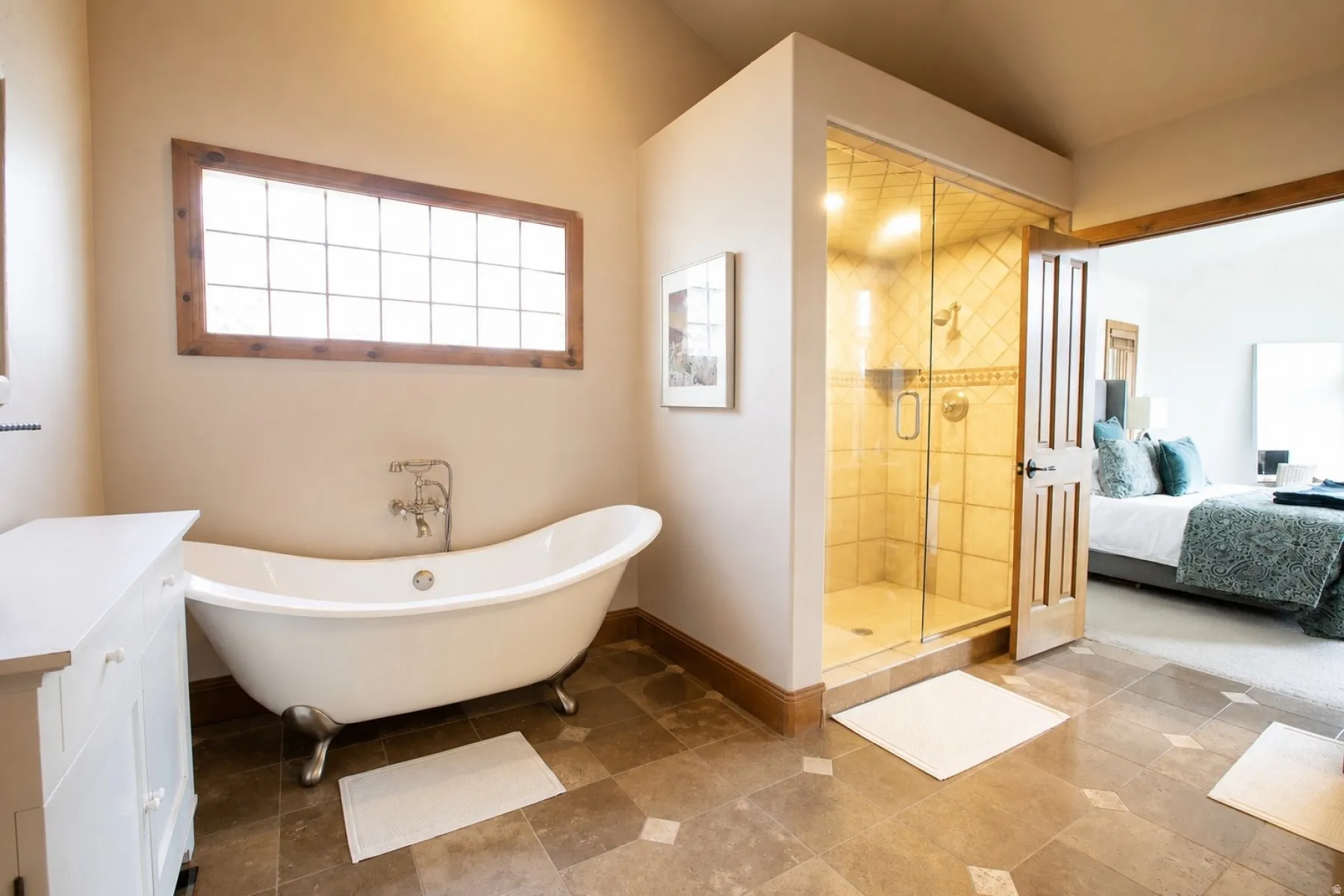 Freestanding soaking tub with polished chrome fixtures