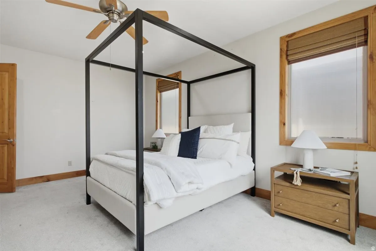 Soft neutral wall tones featuring light-toned carpeting