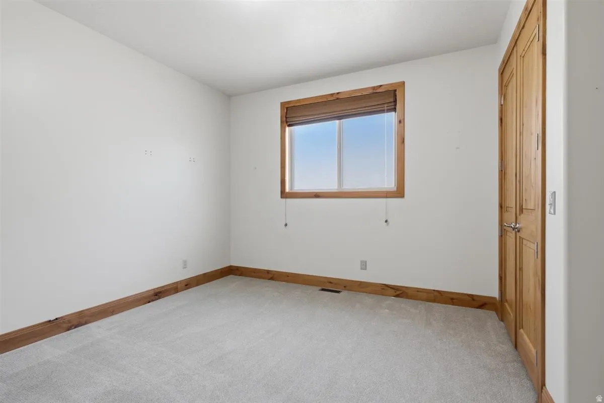 Neutral-toned carpeting paired with white walls