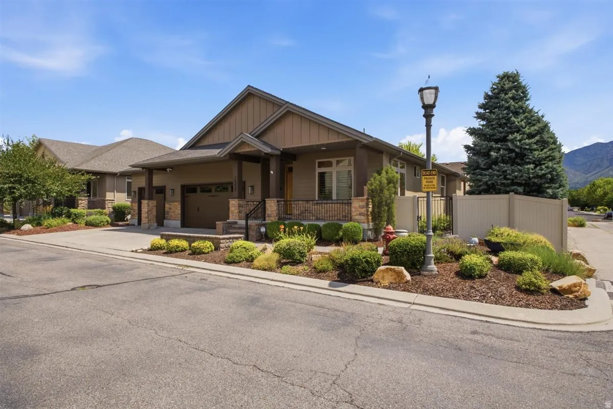 Contemporary exterior featuring earth-toned siding and stone accents