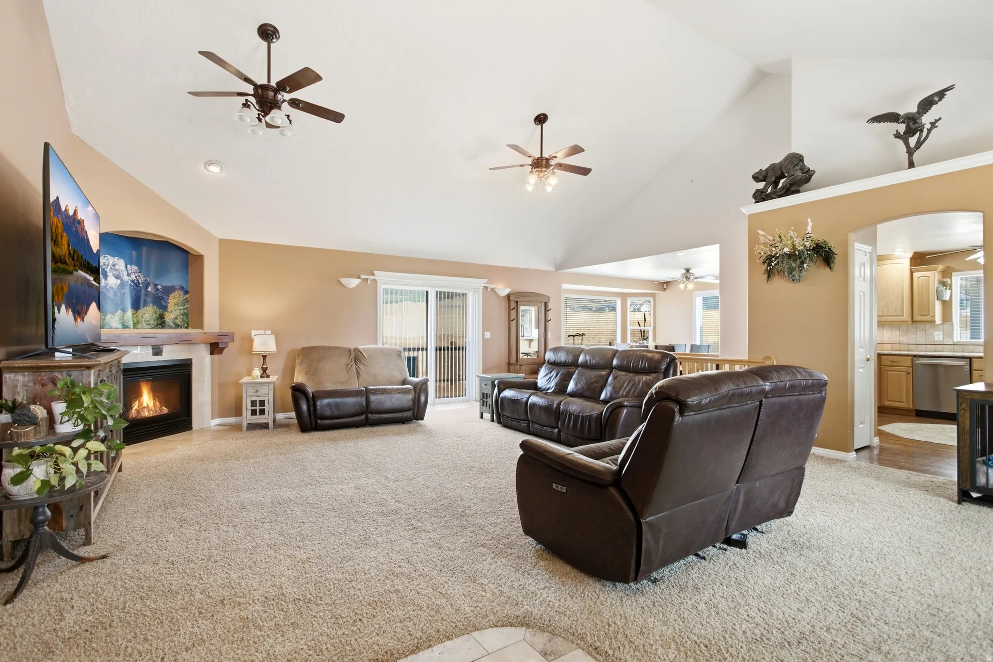 Vaulted ceilings featuring recessed lighting and ceiling fans