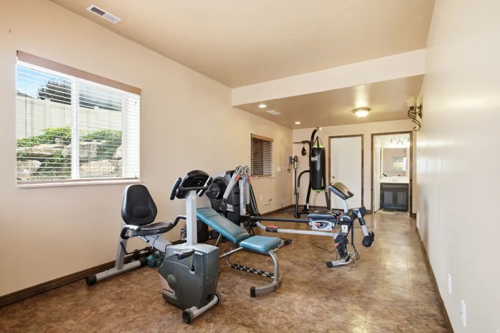 Spacious room featuring wood-finish flooring and neutral wall tones