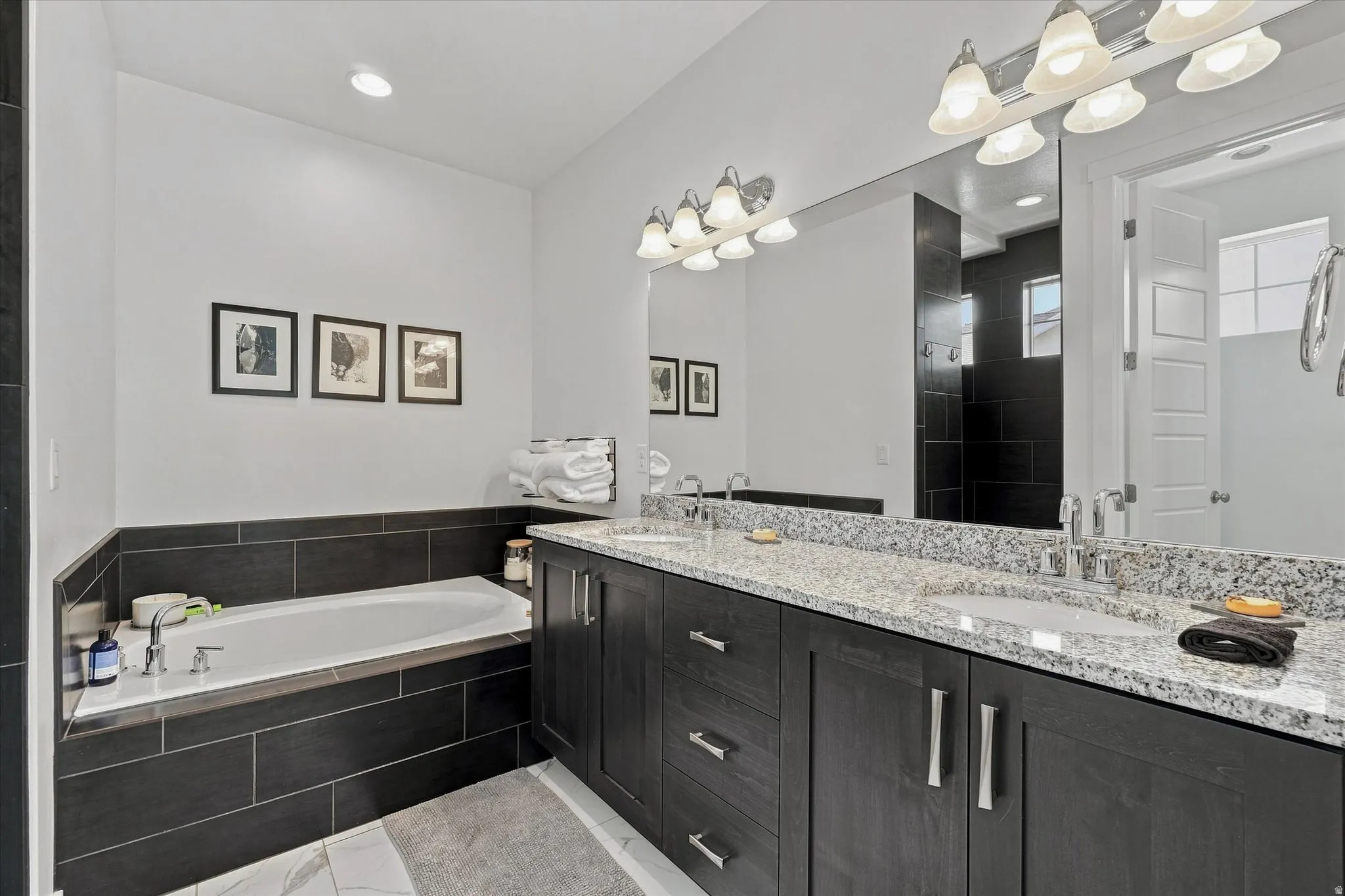 Double vanity with granite countertop and integrated sinks