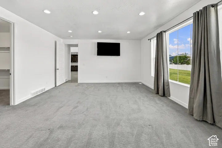 Primary Suite with installed wall mounted TV