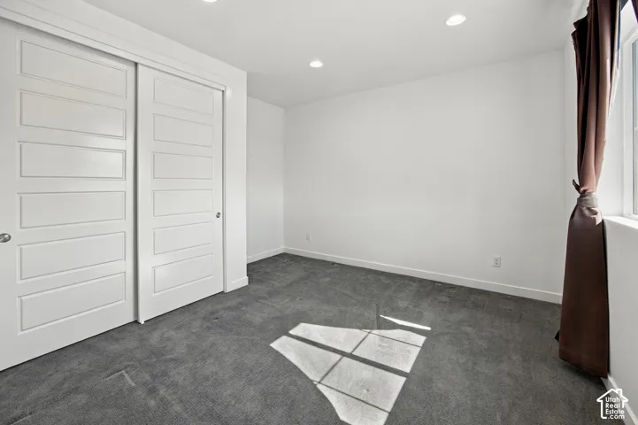 3rd Bedroom White walls, gray carpeting, and recessed lighting