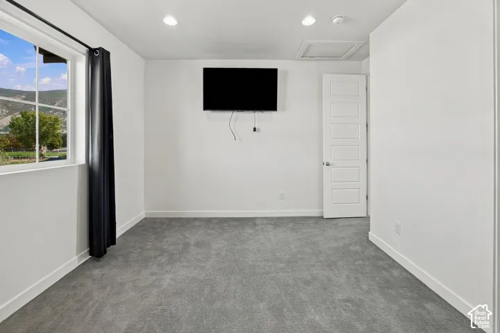 2nd north facing bedroom with wall mounted TV