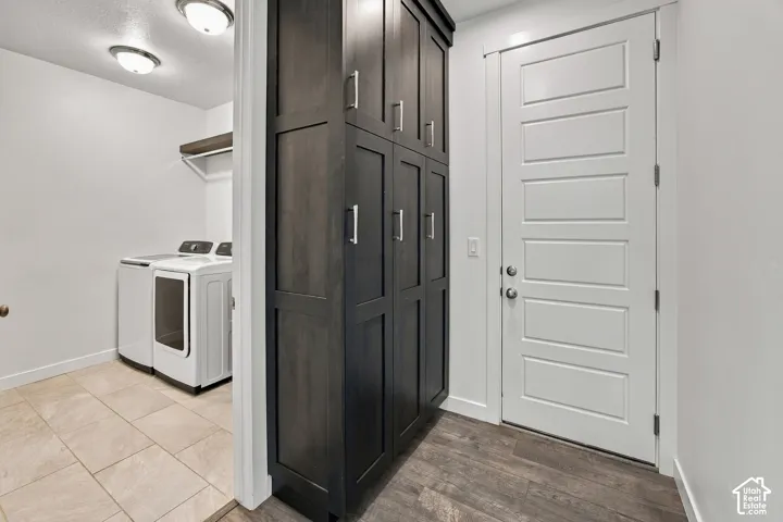 Built-in dark wood cabinetry with silver hardware, white panel doors