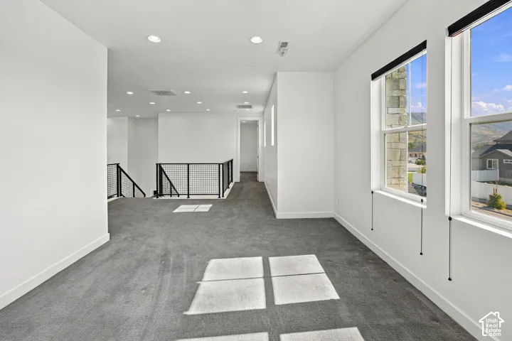 Spacious loft could easily become 4th bedroom with an abundance of windows with top down roller shades