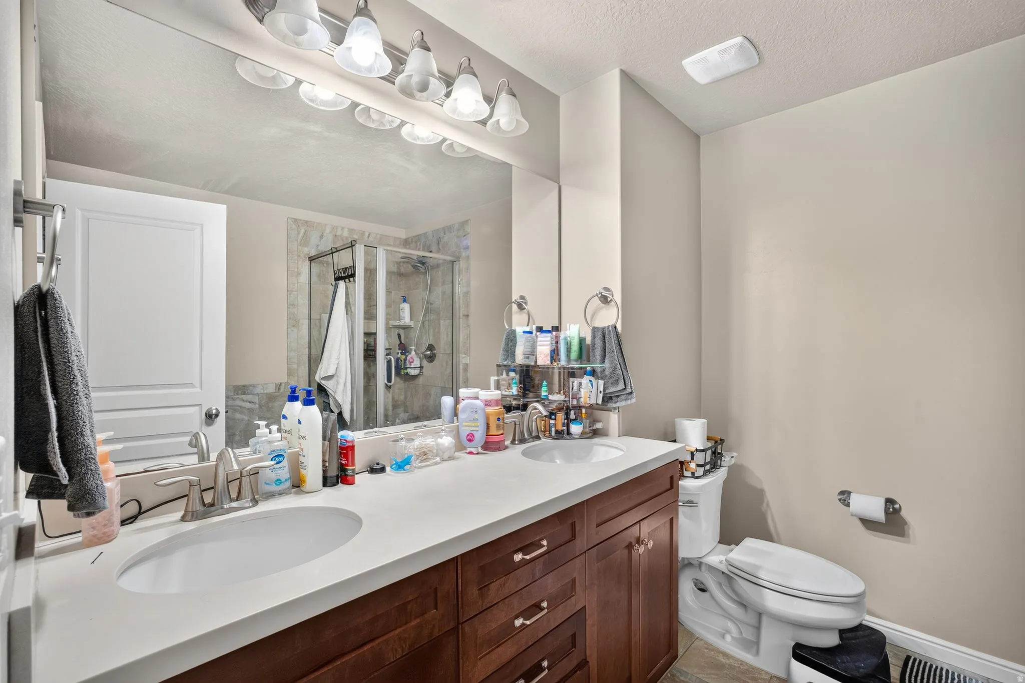 Double vanity featuring integrated sinks and a light-toned countertop