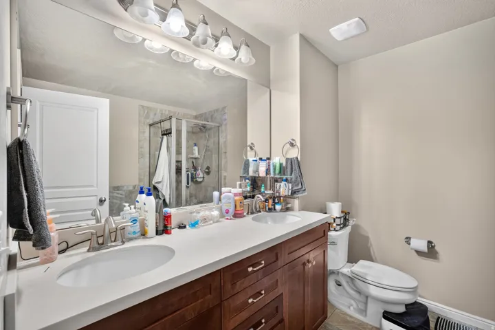 Double vanity featuring integrated sinks and a light-toned countertop