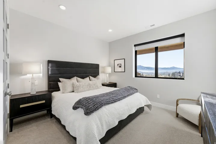 Expansive window framing a distant mountain and valley landscape