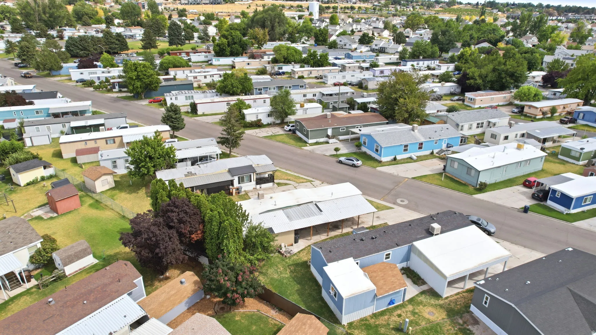 Community of single-story residences with diverse exterior finishes