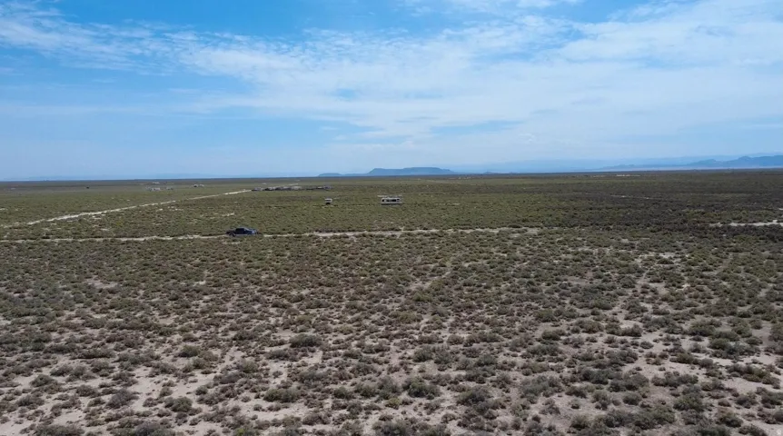 Expansive desert landscape with a clear, open sky overhead