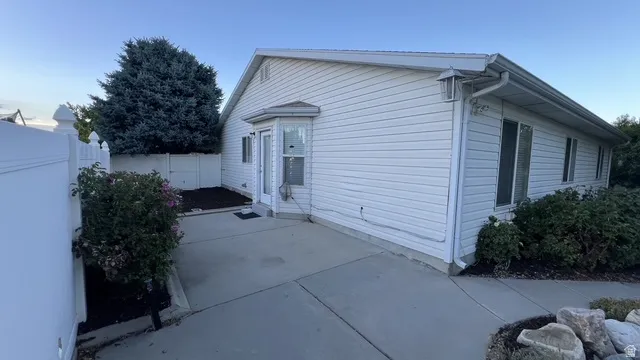 White vinyl siding exterior with an accent bay window