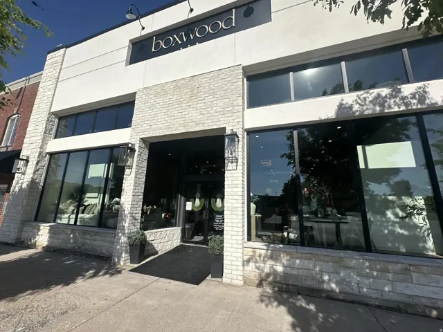 Commercial storefront featuring a stone and stucco facade