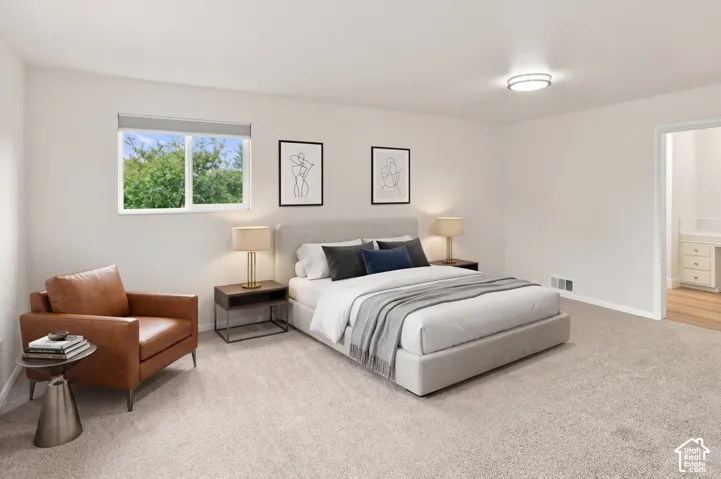 Carpeted flooring, white walls, flush mount ceiling light, and a window with a roller shade