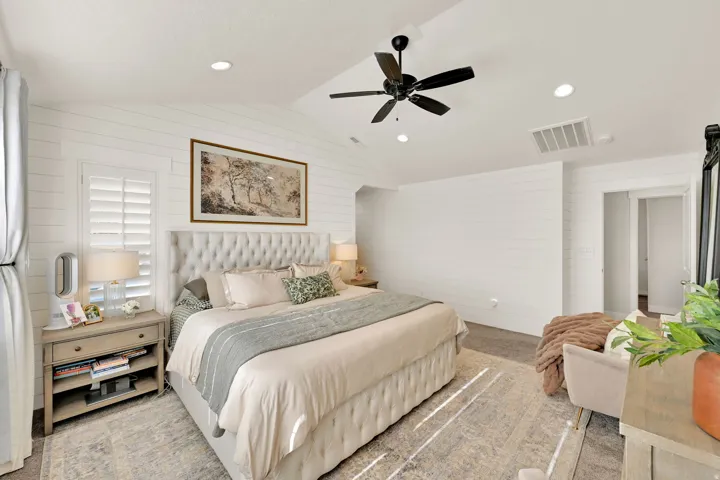 Primary interior space featuring white shiplap walls, recessed lighting, and a ceiling fan