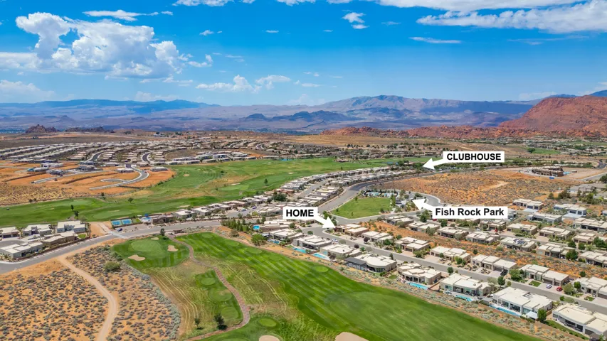 Aerial perspective of a golf course community with numerous modern residences