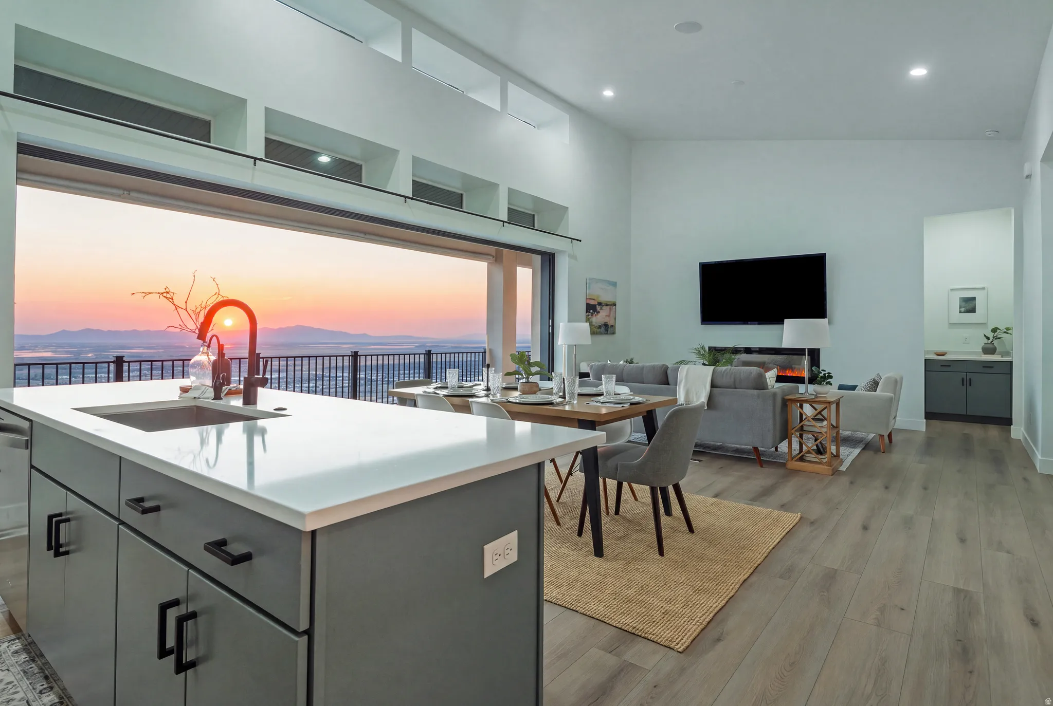Expansive sliding glass doors provide broad scenery