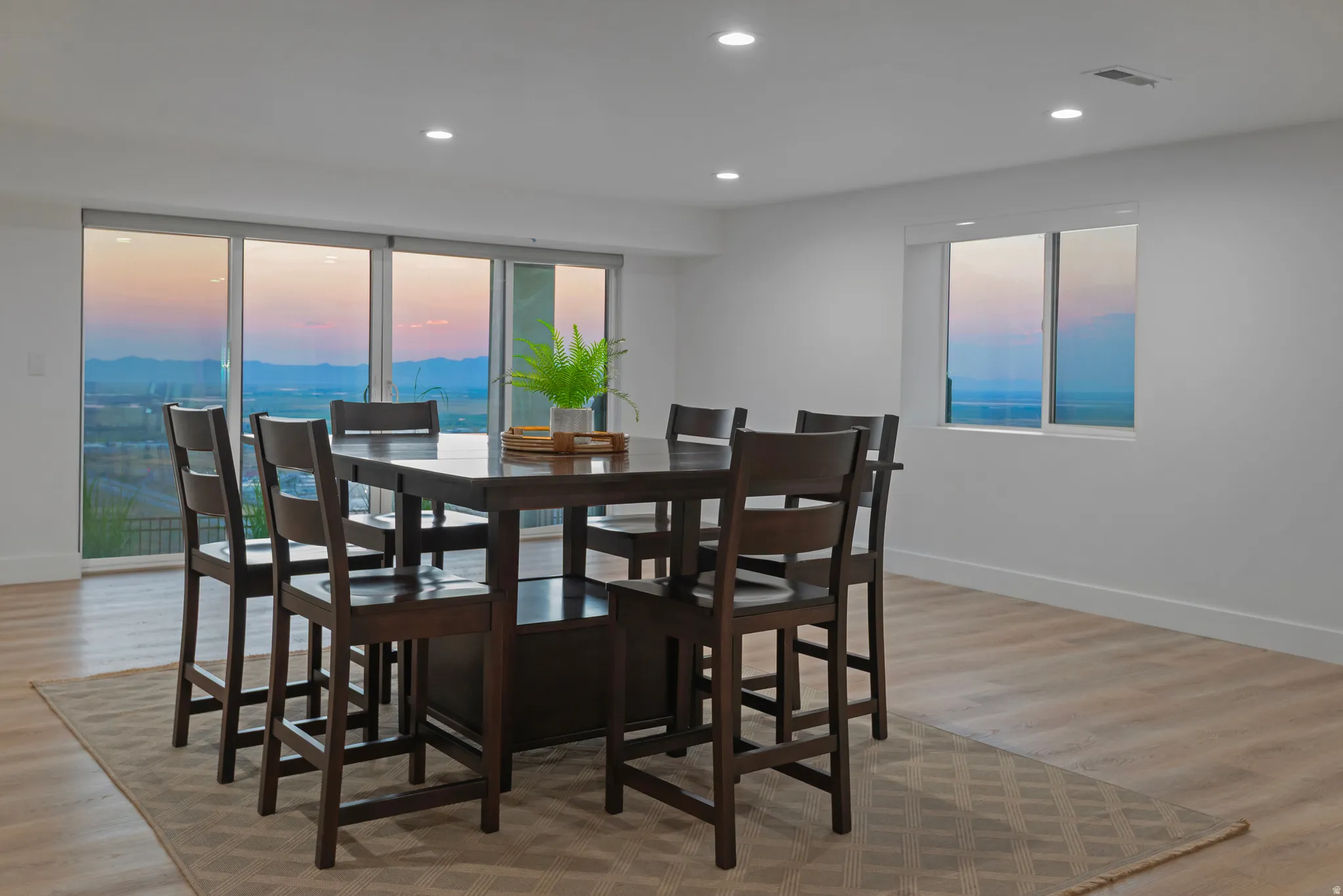 Spacious interior featuring expansive sliding glass doors and an additional window