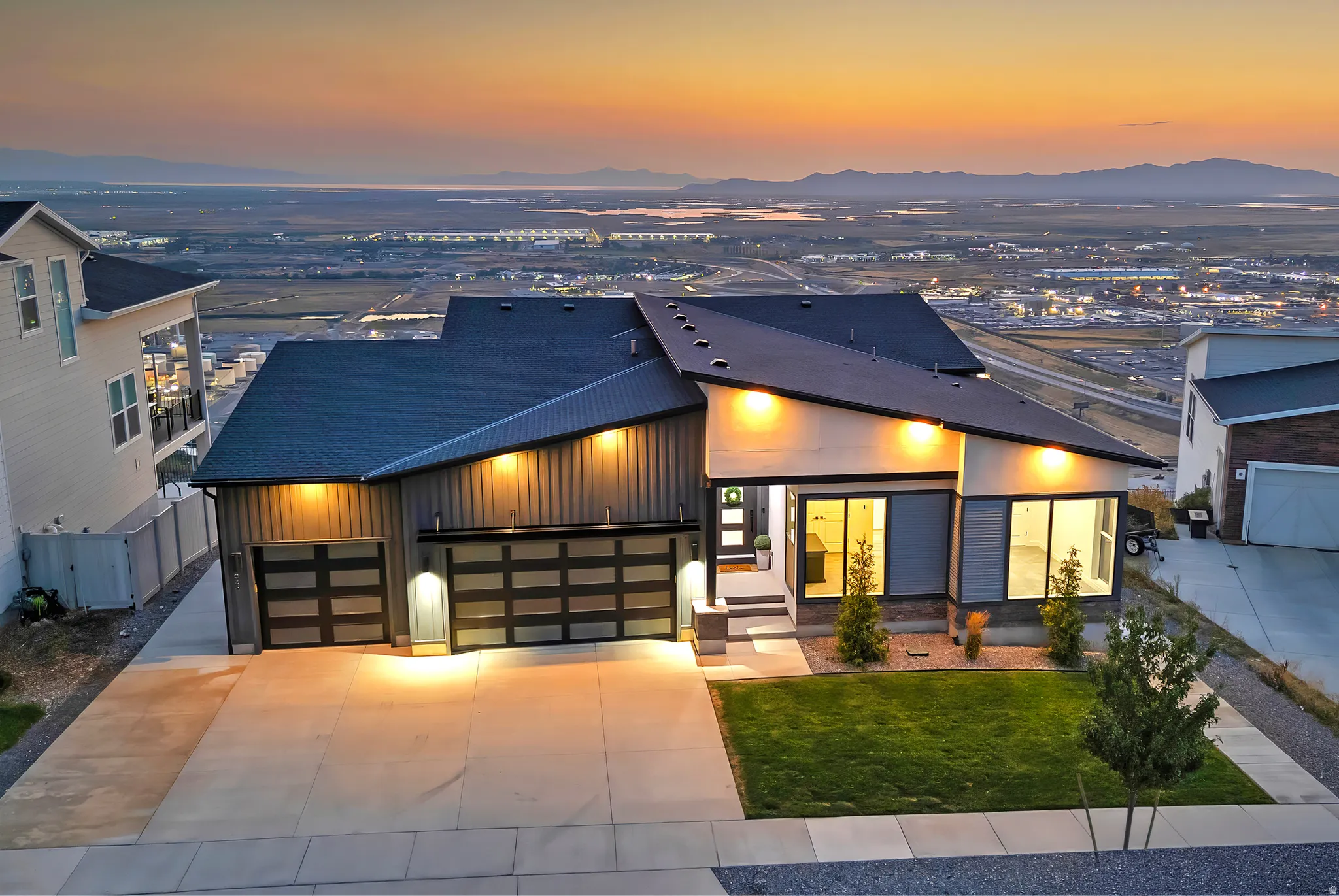 Modern architectural design with a dark roof and varied exterior finishes