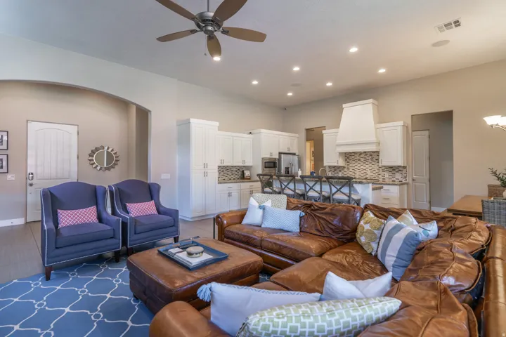 Open-concept living space featuring recessed lighting, a ceiling fan, and light wood-finish flooring