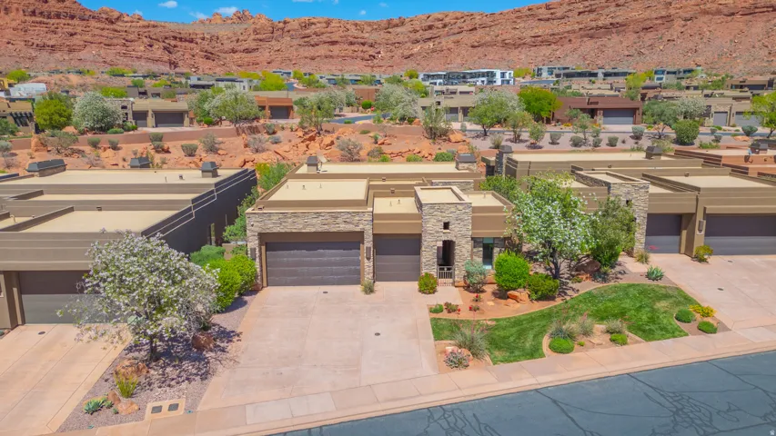 Modern desert-style residence with a flat roofline and stone facade accents