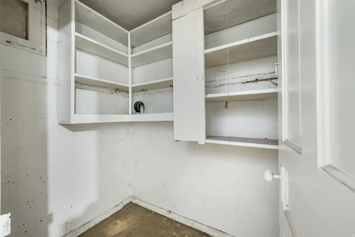 Built-in shelving and cabinetry provide storage solutions