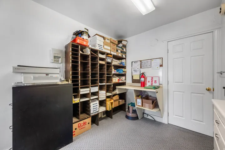 White-painted walls with recessed shelving units