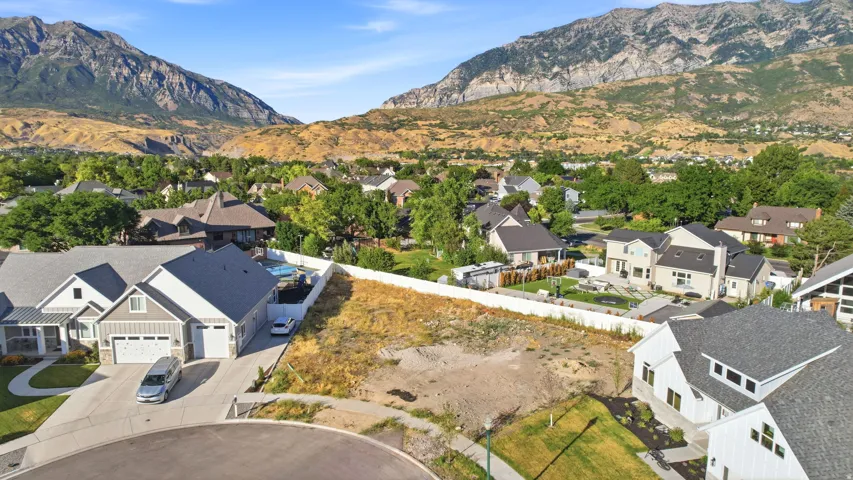 Expansive building lot featuring sloped terrain and mountain scenery