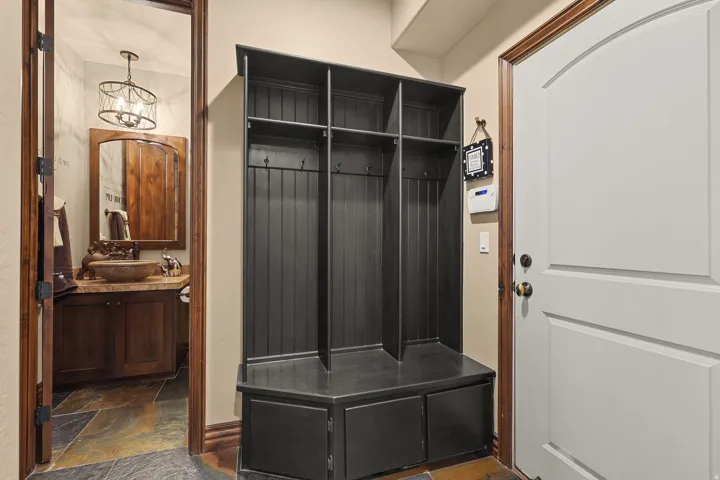 Built-in mudroom unit with bench seating and cubbies