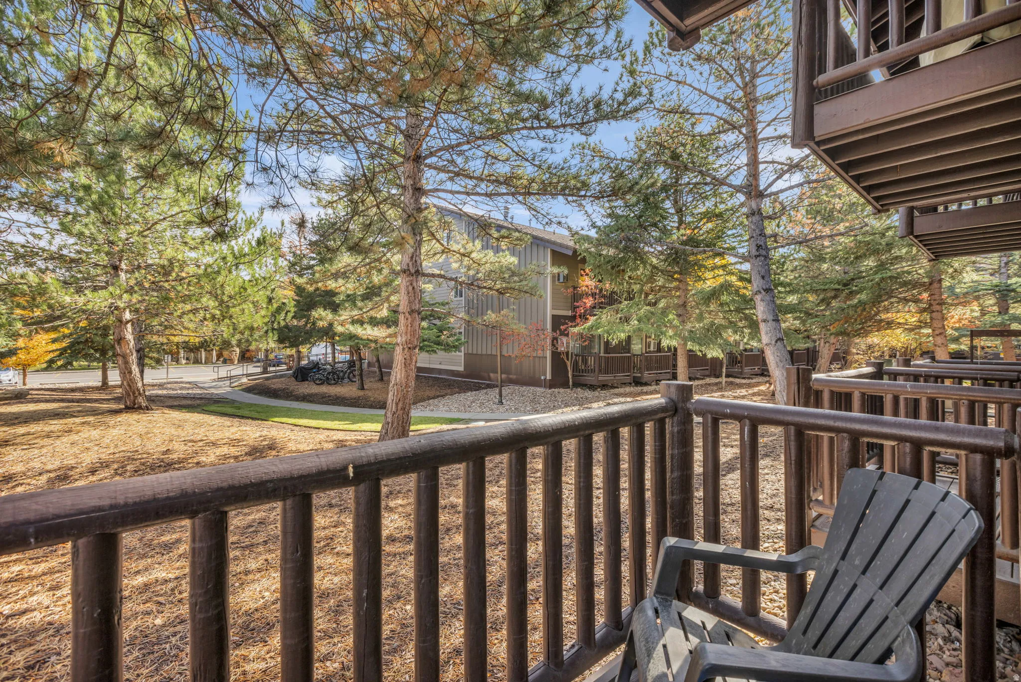 Covered balcony with wood railings