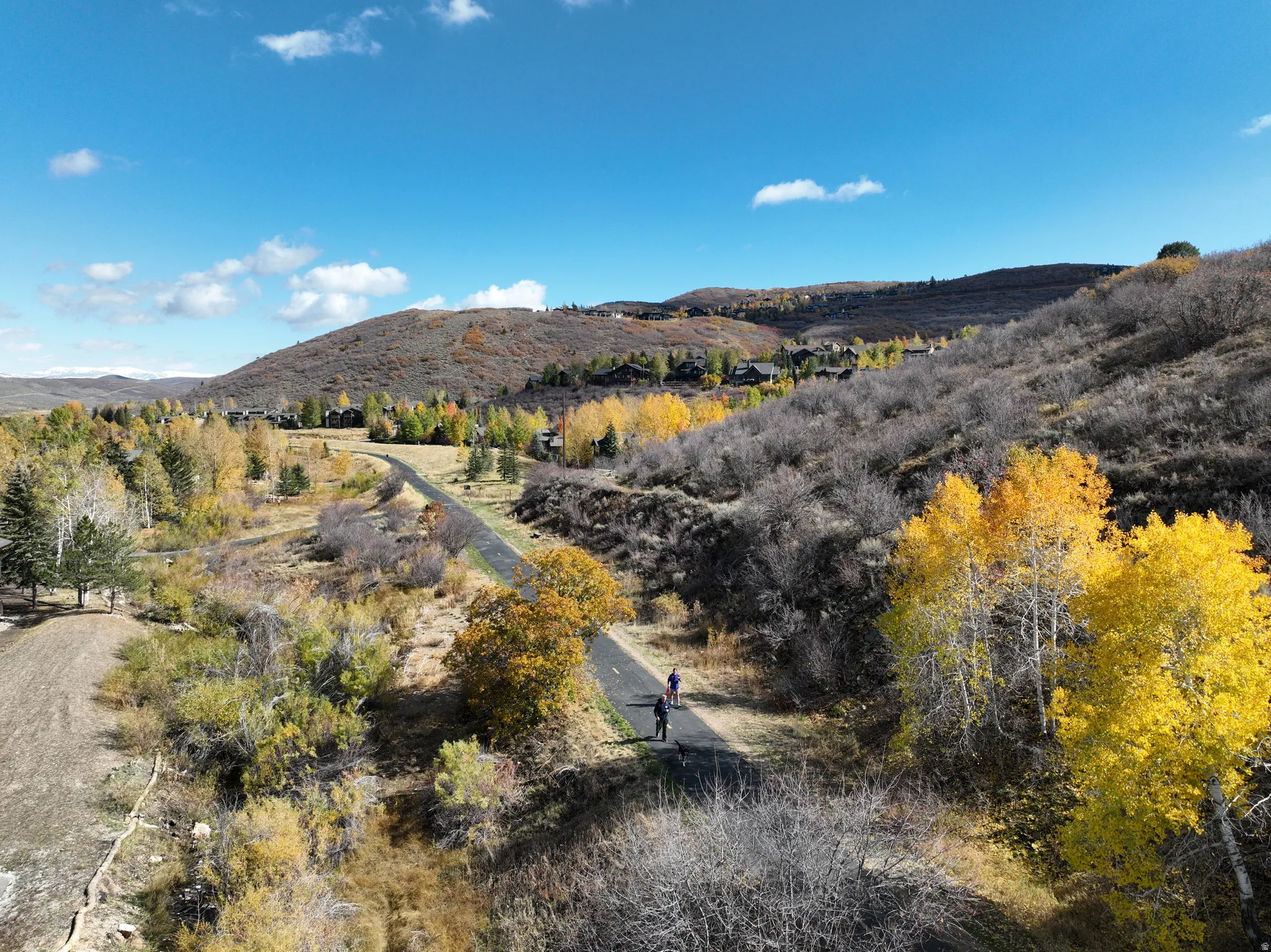 Paved multi-use path traversing natural landscape