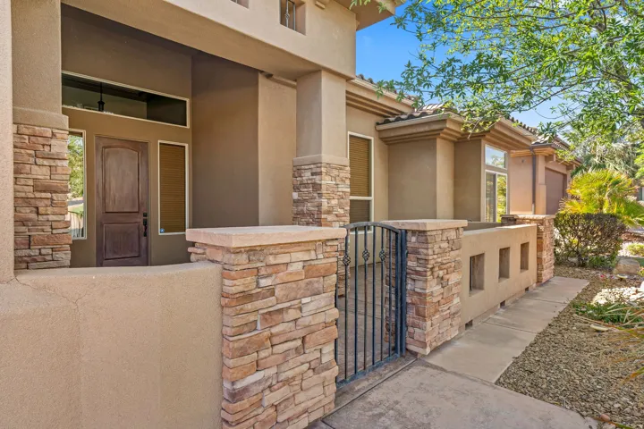 Stucco exterior with stone veneer accents