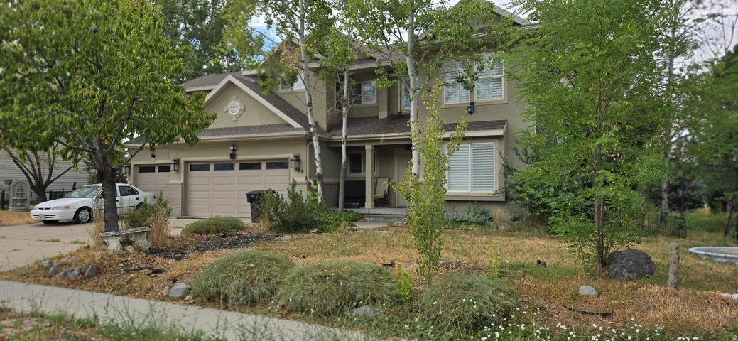 Stucco exterior with multiple gables and a covered entry