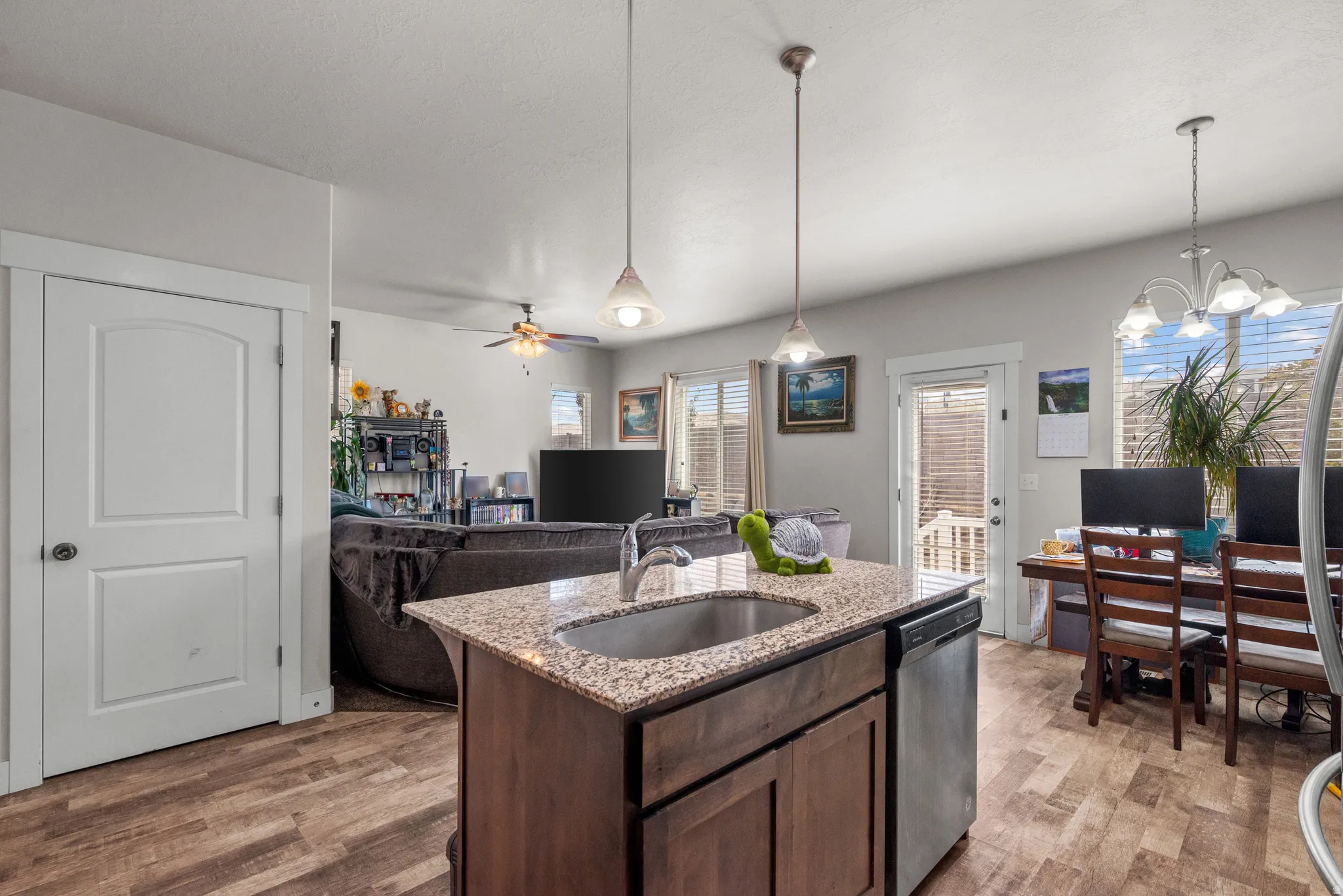 Kitchen island with granite-finish countertop and undermount sink