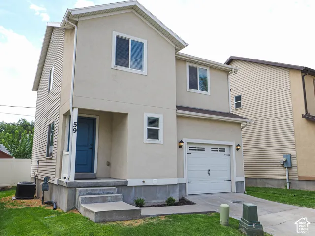 Two-story residence featuring stucco and siding exterior finishes