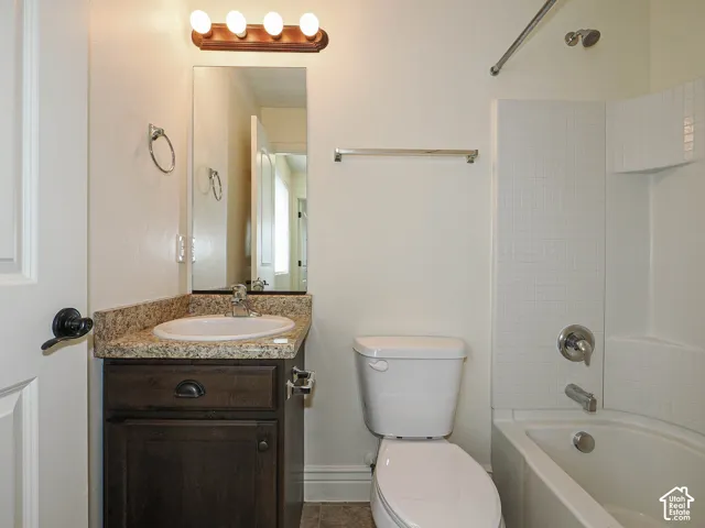 Vanity with a light-toned countertop and an undermount sink